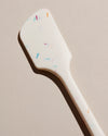 Close up of the GIR Sprinkle Spatula on a cream background. 