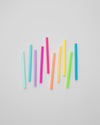 The GIR Cocktail Straws in Glow on a gray background.
