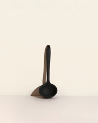 GIR Ultimate Ladle in Black on a cream background.