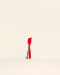 GIR Spatula in Red on a cream background.