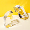 Acrylic Arc Bookends on a  yellow and white background.