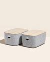 2 Open Spaces Large Felt Storage bins with wooden lids on a cream background.
