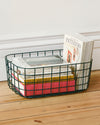 The Open Spaces Large Baskets - Set of 2 in Dark Green with books stored inside it.