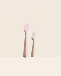 GIR Skinny and Mini Spatula Set in Sprinkles and Light Pink on a cream background.