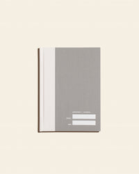 Abridged Journal in Grey on a cream background