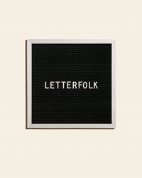 Letterfolk Poet Letter Board in Black on a cream background.