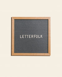 Letterfolk Poet Letter Board in Grey on a cream background.
