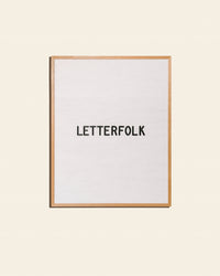 Letterfolk Wordsmith Letter Board in White on a cream background.