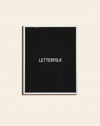 Letterfolk Writer Letter Board in Black on a cream background.