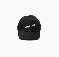 The Thinking Cap in black on a white background. 