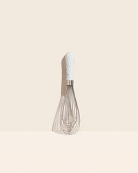 GIR Ultimate Whisk in Barcelona on a cream background.