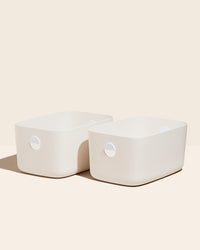 Two Open Spaces Large Cream Storage Bins with no lids on a cream background. 