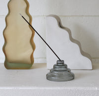 The Gray Glass Meso Incense Holder on a white background.
