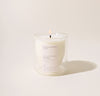 A 6 Oz Aviles Double wall  candle on a cream background. 