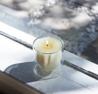 Top view of the 6 oz  Double wall candle on a white window sill. 