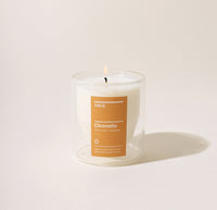 A 6 Oz Citronella  Double wall candle on a cream background. 
