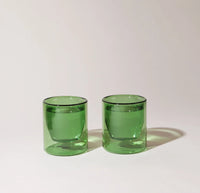 Two 6 oz Verde Double Wall Glasses on a cream background. 