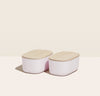 Open Spaces - Two small storage bins placed side by side in Light Pink with wooden lids.